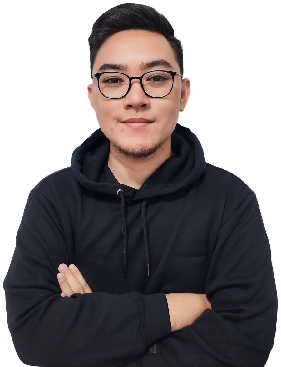 Portrait of Kurt Zeke Magay, arms crossed, wearing glasses and a black hoodie